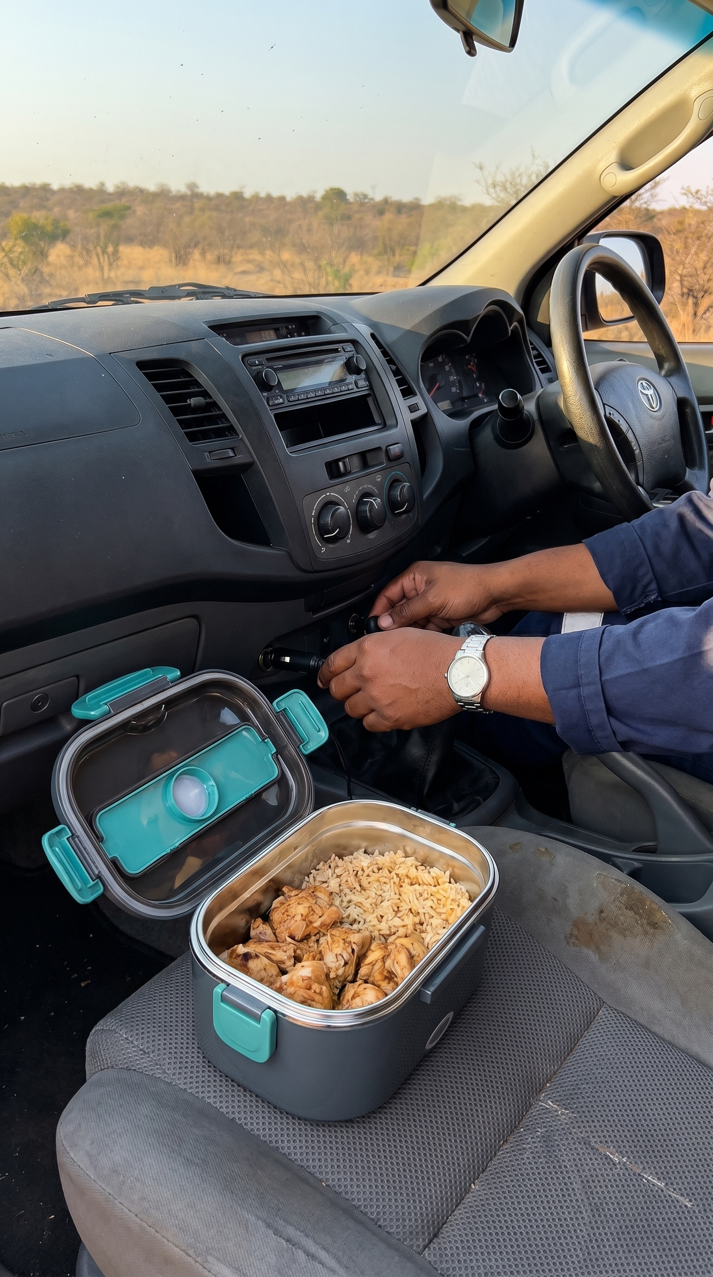 HeatBox 1.0 plugged into a bakkie 12V socket with hot meal